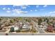 Aerial view showcases the neighborhood, nearby street, and the proximity to urban conveniences at 1299 S Dale Ct, Denver, CO 80219