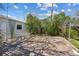 Private backyard with a stone patio and surrounding greenery at 1299 S Dale Ct, Denver, CO 80219