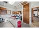 Basement space featuring built-in shelving, ample workspace, natural lighting, and easy access to upper levels at 1299 S Dale Ct, Denver, CO 80219