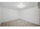 Empty finished basement with new carpet and a blank canvas at 1299 S Dale Ct, Denver, CO 80219