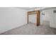 Cozy basement bedroom with closet and neutral carpet at 1299 S Dale Ct, Denver, CO 80219