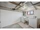 Unfinished basement laundry area with washer and dryer hookups at 1299 S Dale Ct, Denver, CO 80219