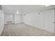 Finished basement with neutral carpet, white walls, and recessed lighting at 1299 S Dale Ct, Denver, CO 80219