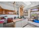 Basement area with built-in storage, work space, overhead lighting, and bright window views at 1299 S Dale Ct, Denver, CO 80219