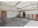 Spacious garage interior featuring ample storage, workbench, and a clean, organized space at 1299 S Dale Ct, Denver, CO 80219