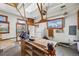A spacious garage with natural light, a workbench, and ample storage space at 1299 S Dale Ct, Denver, CO 80219