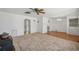 Bright living room featuring neutral carpet, and white walls, and an adjoining dining space at 1299 S Dale Ct, Denver, CO 80219