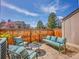Inviting backyard patio featuring paver stones, comfortable seating and lush surroundings perfect for outdoor relaxation at 9658 W Chatfield Ave # D, Littleton, CO 80128