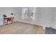 Bedroom featuring hardwood floors, large windows, and a desk at 9658 W Chatfield Ave # D, Littleton, CO 80128