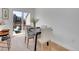 Bright dining area features a table set for four and sliding glass doors to a patio at 9658 W Chatfield Ave # D, Littleton, CO 80128