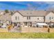 Aerial view of the back of the property features a patio and yard that enhance outdoor living at 9658 W Chatfield Ave # D, Littleton, CO 80128