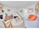 Bright living room boasts a fireplace, modern decor, and open staircase, creating an inviting and stylish space at 9658 W Chatfield Ave # D, Littleton, CO 80128