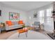 Inviting living room with neutral decor, hardwood floors, and large windows providing ample natural light at 9658 W Chatfield Ave # D, Littleton, CO 80128