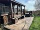 Spacious back deck offers outdoor seating with bench and steps to landscaped backyard at 12452 W Dumbarton Pl, Morrison, CO 80465
