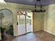 Bright dining area with sliding glass doors to deck and unique decorative wall paint at 12452 W Dumbarton Pl, Morrison, CO 80465