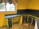 Office area features custom cabinets, counter space, and a bright window at 12452 W Dumbarton Pl, Morrison, CO 80465