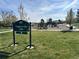 A sign at Trappers Glen Park with playground in the background at 12452 W Dumbarton Pl, Morrison, CO 80465