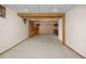Spacious basement with exposed beams, a wet bar, built-in shelves, and neutral carpeting at 9025 Jellison Ct, Broomfield, CO 80021