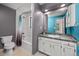 Cozy bathroom with a modern vanity and a shower-tub combination with colorful shower curtains at 9025 Jellison Ct, Broomfield, CO 80021