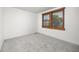 Well-lit bedroom with neutral carpet, a window with wood blinds, and ample space at 9025 Jellison Ct, Broomfield, CO 80021