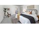 Bedroom with carpet, a large bed, and access to an en-suite bathroom at 9025 Jellison Ct, Broomfield, CO 80021