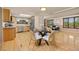 Bright kitchen with stainless steel appliances, island seating, and access to the living area at 9025 Jellison Ct, Broomfield, CO 80021