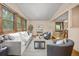 Inviting living room with large windows, comfortable seating, and hardwood floors at 9025 Jellison Ct, Broomfield, CO 80021