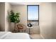 Bedroom featuring chair, table, flower decor, and lovely views at 1020 15Th St # 20N, Denver, CO 80202