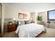 Bright bedroom boasts stylish decor, plush bed, wood nightstands, and a comfy sitting area at 1020 15Th St # 20N, Denver, CO 80202
