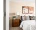 Bright bedroom featuring stylish decor, a plush bed, and a wooden nightstand at 1020 15Th St # 20N, Denver, CO 80202