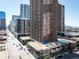 Elevated city view showing high-rise buildings, street traffic, and businesses below at 1020 15Th St # 20N, Denver, CO 80202