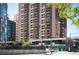 Brick high-rise building in a lively city setting, with ample balconies and street-level commercial spaces at 1020 15Th St # 20N, Denver, CO 80202