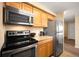 Modern kitchen with stainless steel appliances and granite countertops at 1020 15Th St # 20N, Denver, CO 80202