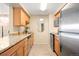 Well-lit kitchen featuring stainless steel appliances, sink and granite countertops at 1020 15Th St # 20N, Denver, CO 80202