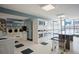 Clean and well-lit laundry room featuring multiple washers and dryers, along with folding table and laundry cart at 1020 15Th St # 20N, Denver, CO 80202