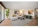 Inviting living room featuring hardwood floors, modern decor, and an open layout with kitchen view at 1020 15Th St # 20N, Denver, CO 80202