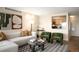 Stylish living room with hardwood floors, comfortable seating, and open view to kitchen at 1020 15Th St # 20N, Denver, CO 80202
