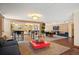 Lounge area with modern decor, a red coffee table, dark blue sofas, and a pass-through to another lounge at 1020 15Th St # 20N, Denver, CO 80202