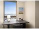 Office features a desk with a beautiful mountain and city view from the window at 1020 15Th St # 20N, Denver, CO 80202
