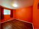 Vibrant bedroom with hardwood floors, a large window, and warm lighting, creating a cozy and inviting space at 7245 S Dexter St, Centennial, CO 80122