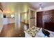 Open-concept living room with hardwood floors, large windows, and natural light, creating a bright and inviting space at 7245 S Dexter St, Centennial, CO 80122