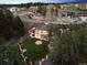Aerial view of a home with a sprawling yard, outdoor fire pit, and neighboring houses at 5787 Powell Rd, Parker, CO 80134