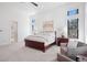 Primary bedroom with a ceiling fan, large windows with views and an ensuite bathroom at 5787 Powell Rd, Parker, CO 80134