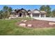 Beautiful home showcasing a well-manicured lawn and a three-car garage at 5787 Powell Rd, Parker, CO 80134