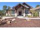 Inviting home exterior featuring a grand entrance with stone accents and professional landscaping at 5787 Powell Rd, Parker, CO 80134