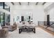 Open-concept living room featuring hardwood floors, high ceilings and ample natural light at 5787 Powell Rd, Parker, CO 80134