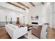 Spacious living room with brick fireplace, hardwood floors, and stylish decor at 5787 Powell Rd, Parker, CO 80134