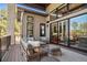 Relaxing outdoor patio area with stylish seating and a view of lush greenery at 5787 Powell Rd, Parker, CO 80134