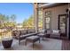 Outdoor patio space with comfortable lounge furniture and views of mature trees at 5787 Powell Rd, Parker, CO 80134