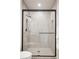 Modern glass shower with gray tiling and sleek hardware, creating a spa-like experience at 5787 Powell Rd, Parker, CO 80134